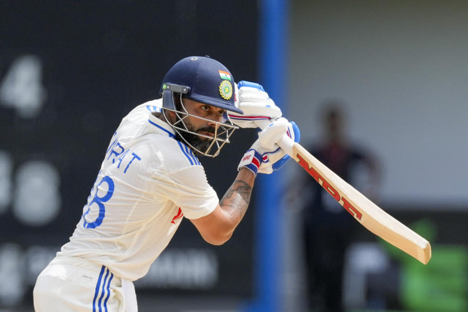 India's Virat Kohli plays the shot to score a century against West Indies on day two of their second cricket Test match at Queen's Park in Port of Spain, Trinidad and Tobago, Friday, July 21, 2023. (AP Photo/Ricardo Mazalan)