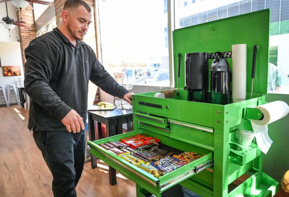 Kinley Gee shows off his tool cart that he uses to sell coffee and snacks out of and to get people to come and check out Downtown Oak.