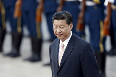 China's President Xi Jinping attends a welcome ceremony outside the Great Hall of the People in Beijing, in this August 19, 2013 file photo. REUTERS/Jason Lee/Files