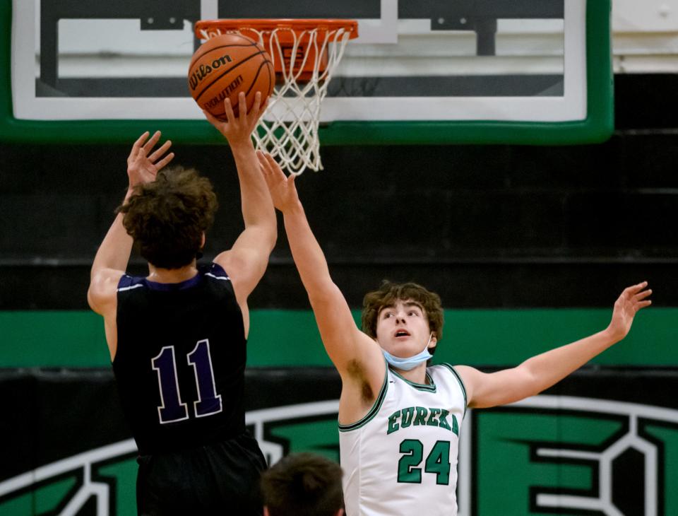 Eureka's Tyler Heffren, right, defends against El Paso-Gridley's Asa Smith in the first half Friday, Jan. 7, 2022 at Eureka High School. The Hornets fell to the Titans 55-46.