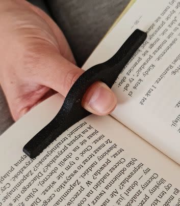 Book lovers, this page holder is useful for flimsy paperbacks