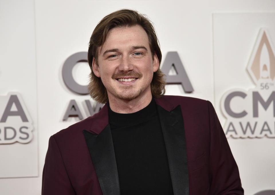 FILE - Morgan Wallen arrives at the 56th annual CMA Awards, Nov. 9, 2022, in Nashville, Tenn. On Tuesday, May 21, 2024, Nashville councilmembers rejected plans for a glowing sign at Wallen's new bar along the city's neon-lit strip of honky tonks, citing his use of a racial slur publicized in 2021 and his recent criminal charges of throwing a chair off a rooftop and nearly hitting two police officers. (Photo by Evan Agostini/Invision/AP, File)