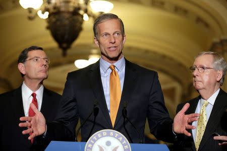 Senator John Thune (R-SD) speaks as Senate Majority Leader Mitch McConnell (R-KY) and Senator John Barrasso (L) listens during a media briefing on Capitol Hill in Washington, U.S., April 25, 2017. REUTERS/Joshua Roberts