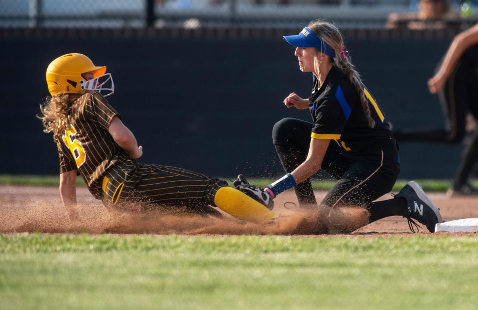 Castle's  Emma Bruggenschmidt (12) tags out Central’s Aubrie Durham (16) as the Castle Knights play the Central Bears during the 2023 IHSAA 4A softball sectional at North high School Tuesday, May 23, 2023.