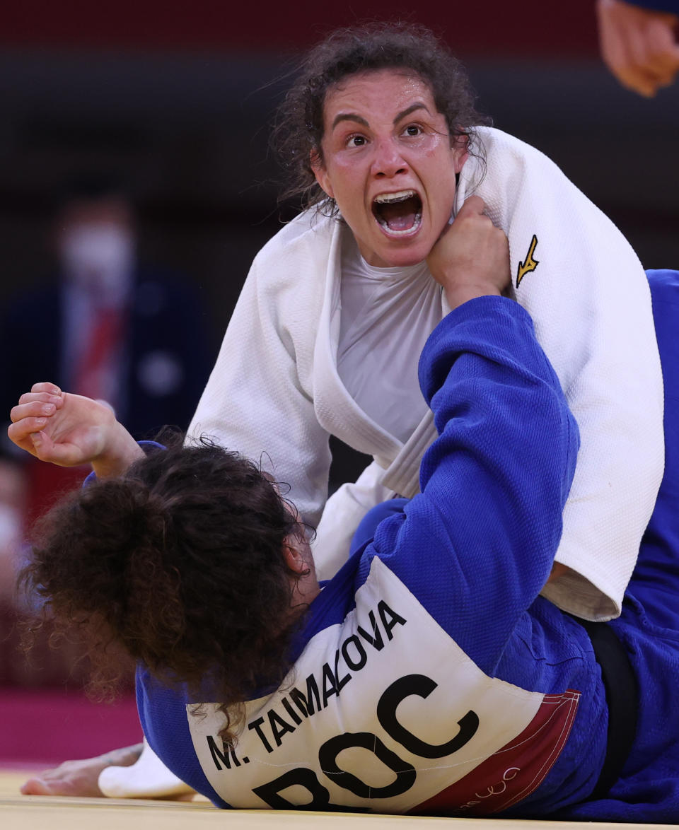 <p>Spain's Maria Bernabeu (top) and Russia's Madina Taimazova compete in ladies' -70kg Elimination Round of 32 judo bout at the Nippon Budokan indoor arena during the 2020 Summer Olympic Games. Stanislav Krasilnikov/TASS (Photo by Stanislav Krasilnikov\TASS via Getty Images)</p> 