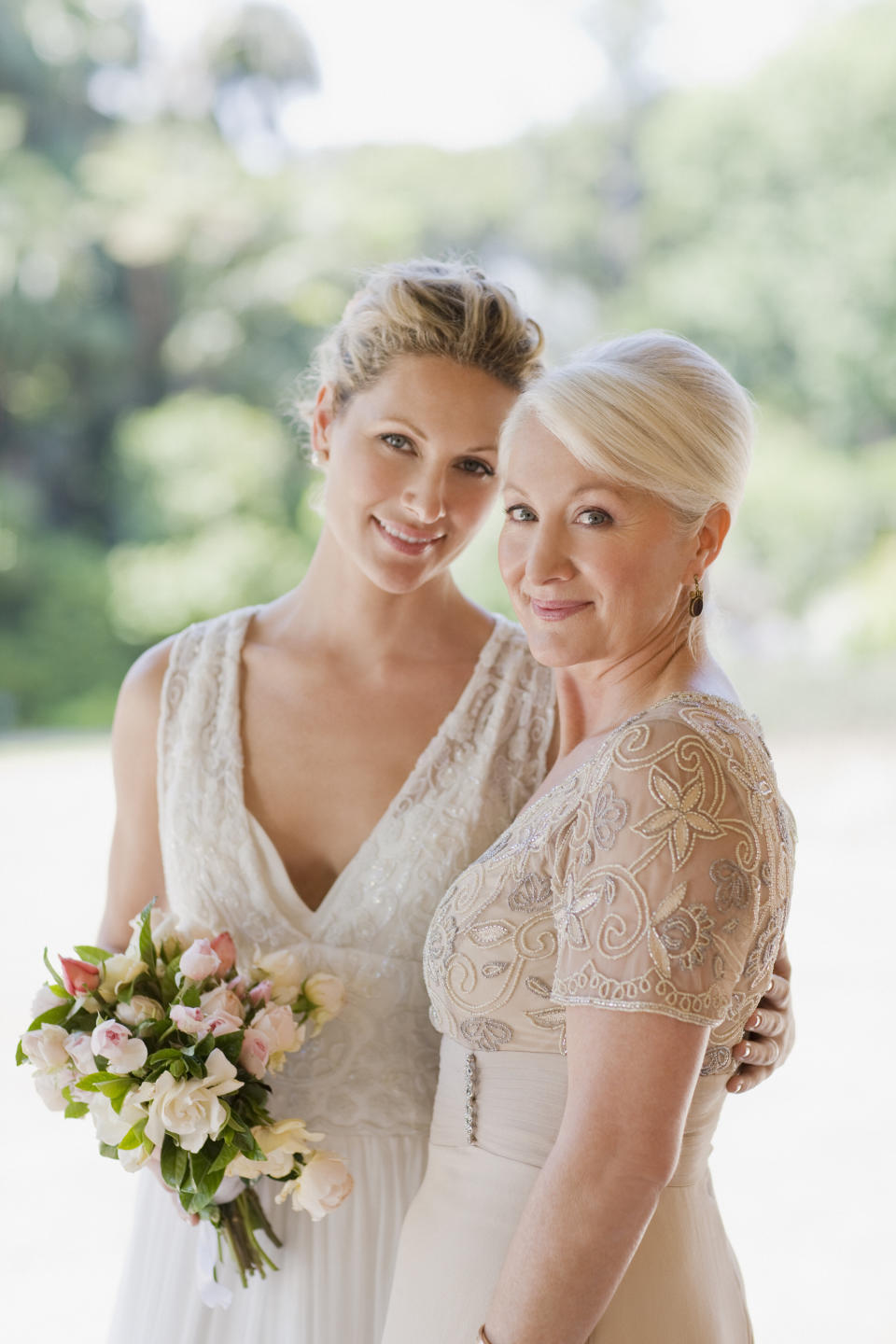 Mother and bride hugging