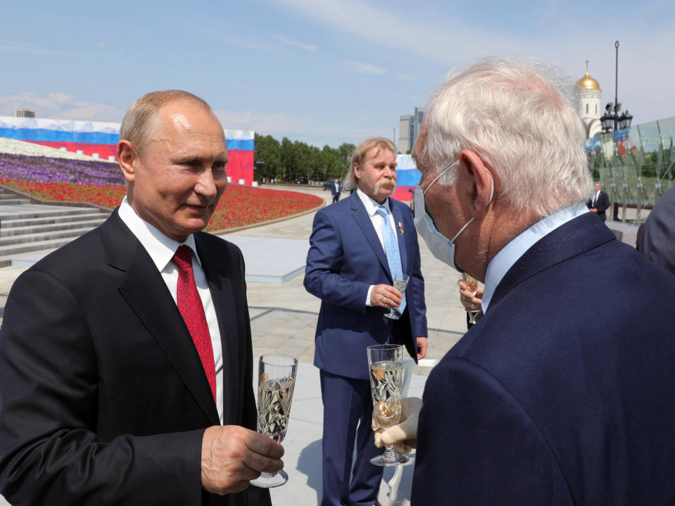 Russian President Vladimir Putin, left, speaks with president of the Scientific Research Institute for Emergency Children's Surgery and Traumatology Leonid Roshal, during a ceremony of handing Gold Stars medals to heroes of labor marking the Day of Russia holiday in Moscow, Russia, on Friday, June 12, 2020. The ceremony marked the first big public event Putin attended since announcing a nationwide lockdown more than two months ago. (Mikhail Klimentyev, Sputnik, Kremlin Pool Photo via AP)