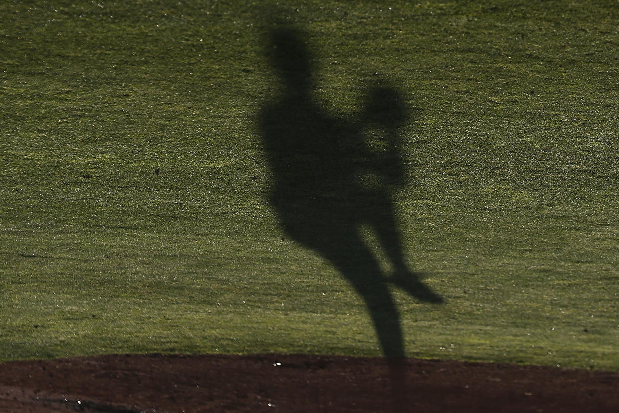 The shadow of Steven Zobac of Cal is seen as he pitches against New Mexico State during an NCAA baseball game on Friday, May 13, 2022 in Berkeley, Calif. (AP Photo/Lachlan Cunningham)