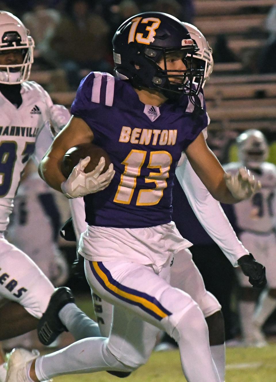 Benton's Pearce Russell runs a first quarter kick-off back for a touchdown against Hahnville in a Class 5A state playoff game Friday