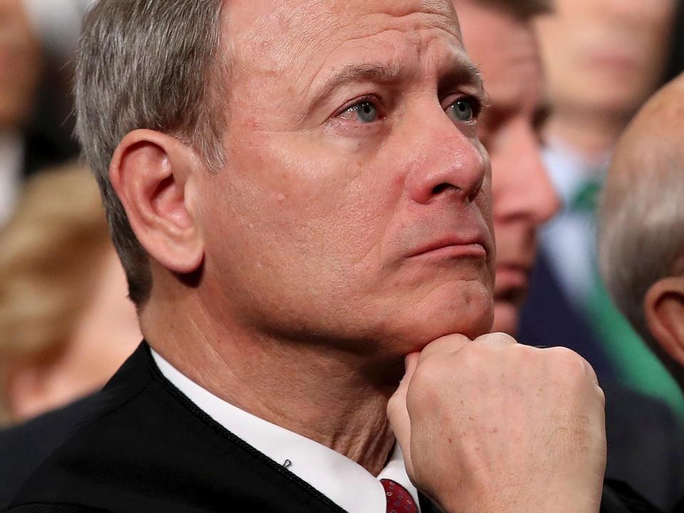 Supreme Court Chief Justice John Roberts listens as President Donald Trump delivers his first State of the Union address in the House chamber of the U.S. Capitol to a joint session of Congress Tuesday in Washington.