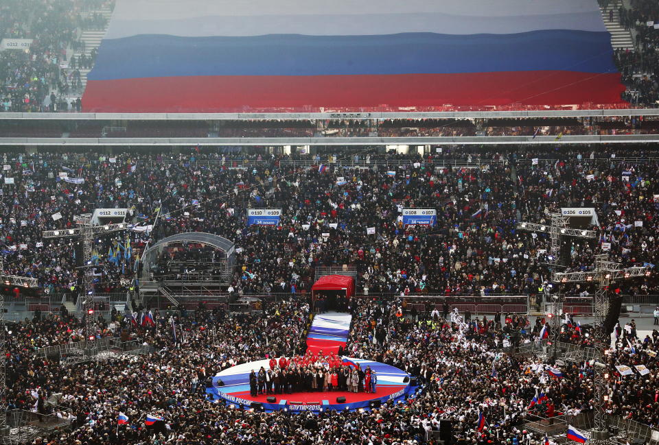 <p>People rally in support of Russia’s incumbent President Vladimir Putin at the Luzhniki Stadium ahead of the 2018 Russian presidential election scheduled for March 18. (Photo: Stanislav Krasilnikov/TASS via Getty Images) </p>