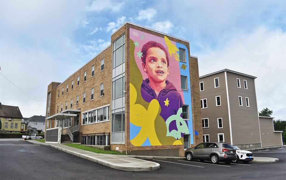 A mural is painted along the side of a Fall River School Department building at 2501 S. Main St. on Friday, Aug. 9, 2024. Once home to a nunnery and then the Atlantis Charter School, students from the Stone Therapeutic Day School will use the building.