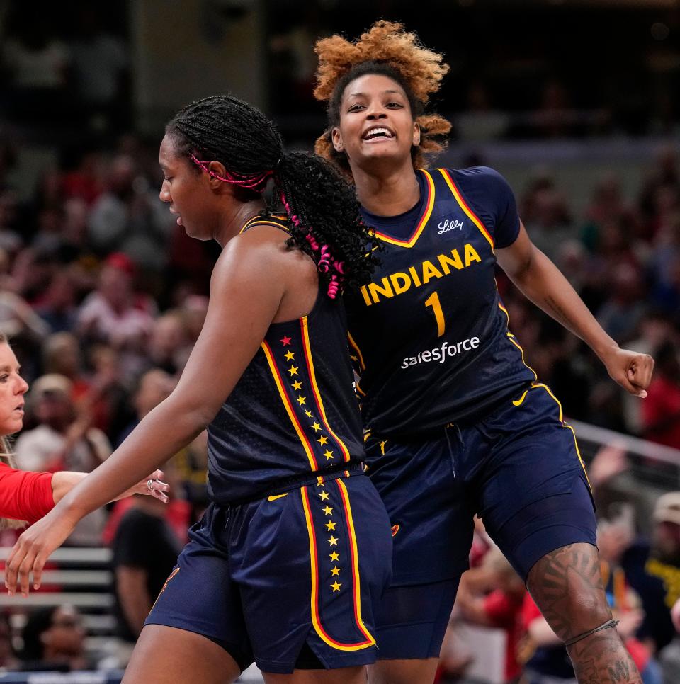 Indiana Fever forward NaLyssa Smith (1) celebrates with Indiana Fever forward Aliyah Boston (7) on Wednesday, Sept. 4, 2024, during the game at Gainbridge Fieldhouse in Indianapolis. The Indiana Fever defeated the Los Angeles Sparks, 93-86.