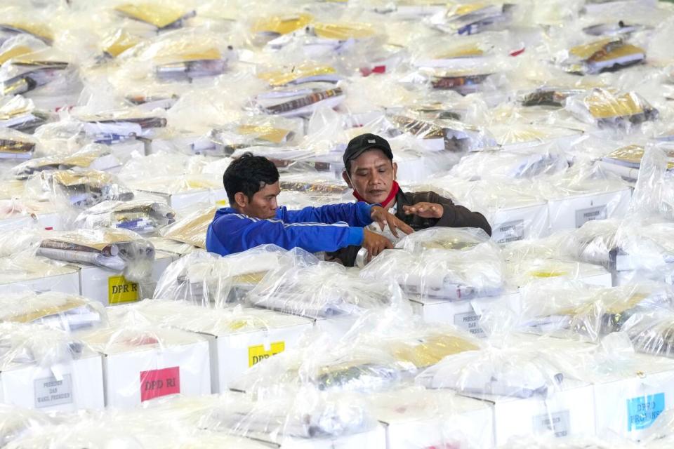 Workers prepare ballot boxes to be distributed to polling stations ahead of the Feb. 14 election, in Jakarta, Indonesia, Tuesday, Feb. 13, 2024. Indonesia, the world's third-largest democracy, will open its polls on Wednesday to nearly 205 million eligible voters in presidential and legislative elections, the fifth since Southeast Asia's largest economy began democratic reforms in 1998. 