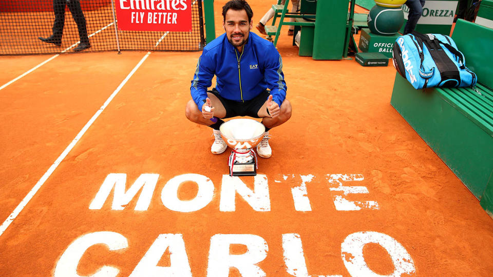 Fabio Fognini poses for a photograph with his winners trophy. (Photo by Clive Brunskill/Getty Images)