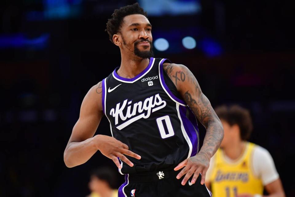 Sacramento Kings guard Malik Monk (0) reacts after scoring a 3-point basket against the Los Angeles Lakers during the second half Wednesday at Crypto.com Arena in Los Angeles.