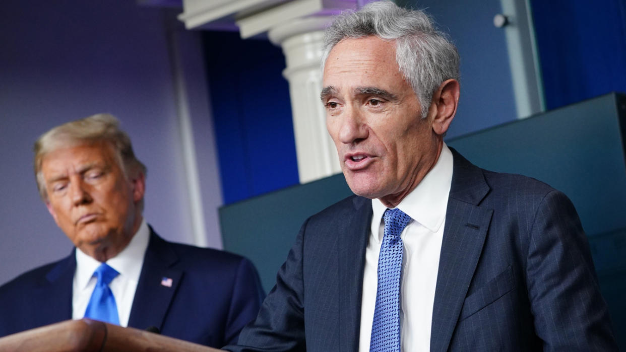 US President Donald Trump (L) listens to White House coronavirus adviser Dr. Scott Atlas speak during a press conference in the Brady Briefing Room of the White House on September 23, 2020, in Washington, DC. (Mandel Ngan/AFP via Getty Images)