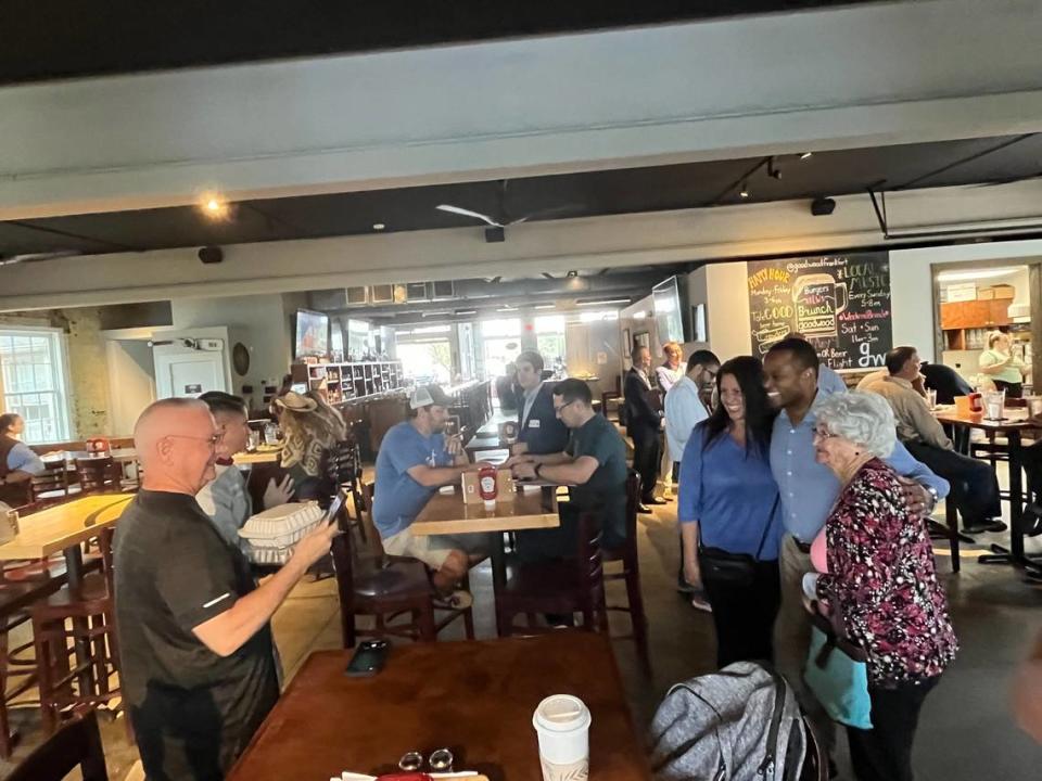 Attorney General Daniel Cameron takes photos with supporters at Goodwood Brewing in Frankfort