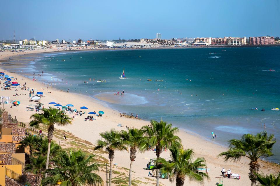 Visitors enjoy a Saturday on Sandy Beach in Puerto Penasco, Mexico.