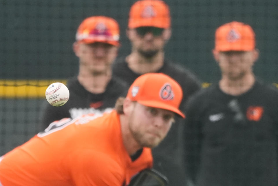 Baltimore Orioles pitcher Corbin Burnes throws during live batting practice at spring training in Sarasota, Fla., Saturday, Feb. 17, 2024. (AP Photo/Gerald Herbert)