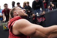 Arizona Cardinals defensive end J.J. Watt signs autographs before an NFL football game against the Carolina Panthers on Sunday, Oct. 2, 2022, in Charlotte, N.C. (AP Photo/Jacob Kupferman)