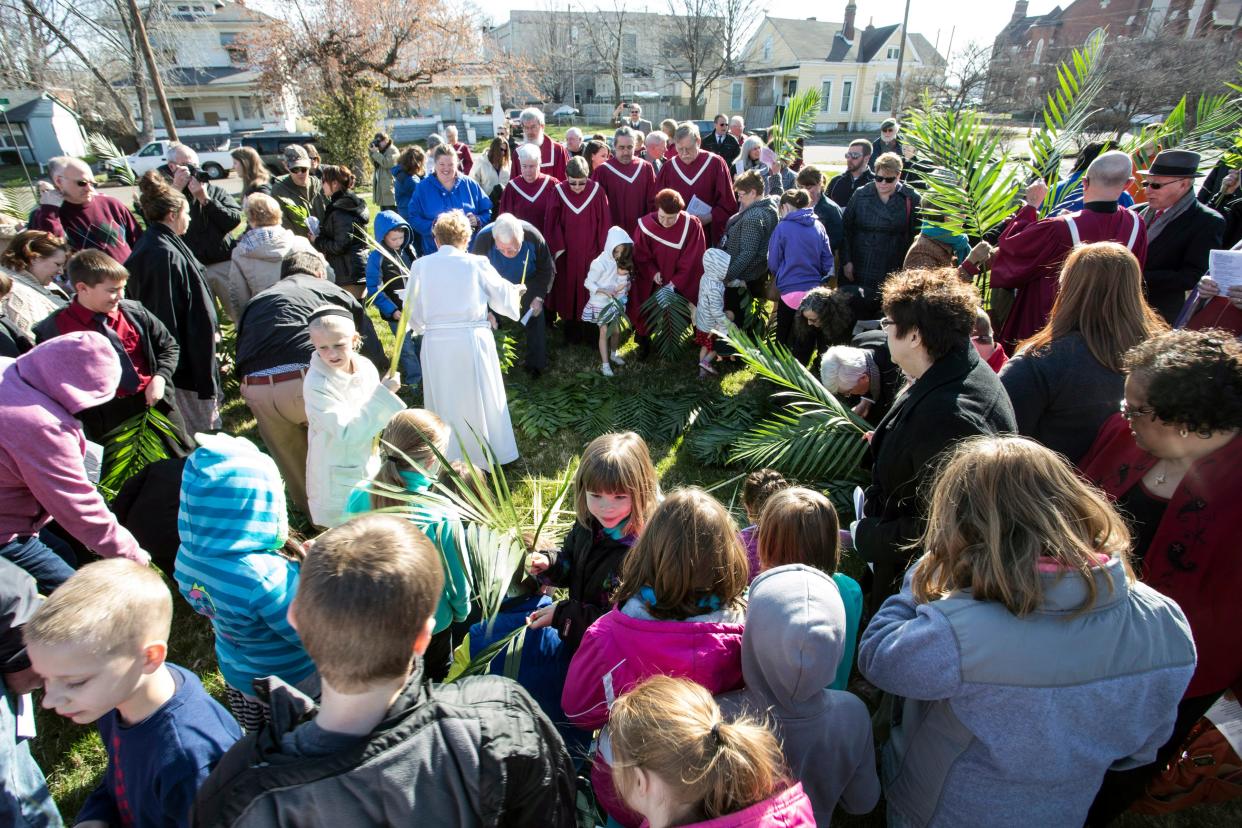 A crowd in the hundreds, representing several area churches, took part in a Palm Sunday tradition in Jeffersonville in a grassy lot behind St. Luke's on Maple Street. 3/29/15