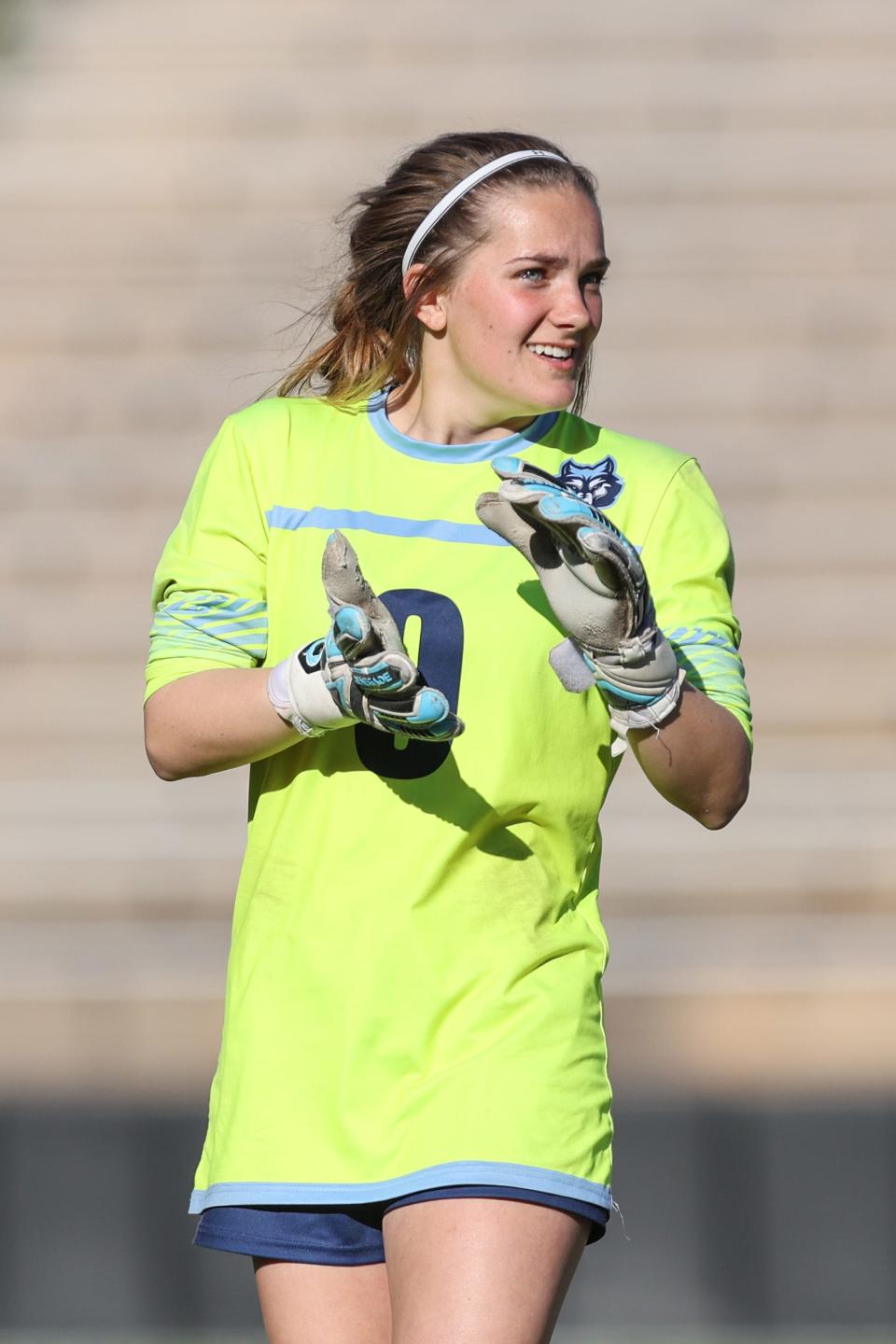 West Plains’ Bella Hawley (0) encourages her team in a 4A Area Round Playoff game against Estacado, Tuesday, March 28, 2023, at Happy State Bank Stadium in Canyon, Texas.  West Plains won 3-0.