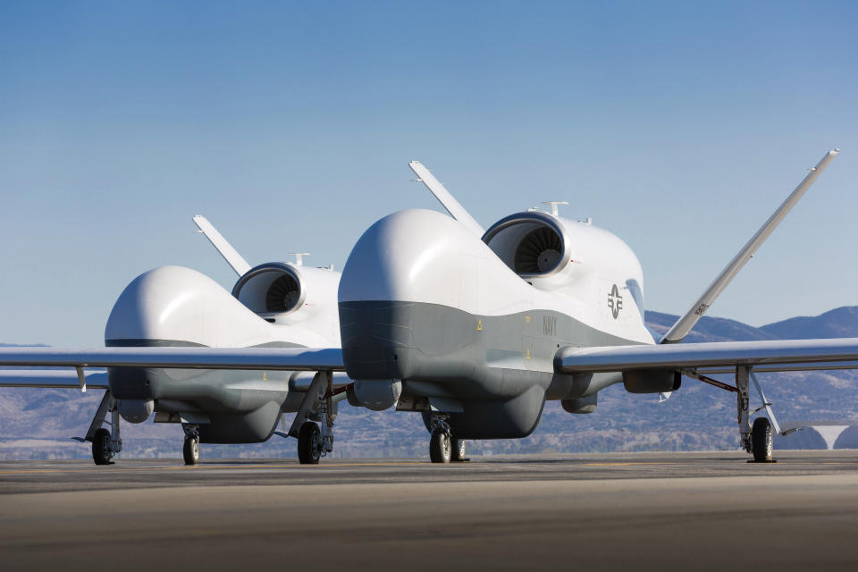 Two Northrop Grumman MQ-4C Triton unmanned aerial vehicles are seen on the tarmac at a Northrop Grumman test facility in Palmdale, California May 22, 2013 in this handout photo provided by the U.S. Navy May 22, 2013.  Photo taken May 21, 2013.  U.S. Navy photo courtesy of Northrop Grumman/Chad Slattery/Handout via Reuters  (UNITED STATES - Tags: MILITARY SCIENCE TECHNOLOGY CONFLICT TRANSPORT) FOR EDITORIAL USE ONLY. NOT FOR SALE FOR MARKETING OR ADVERTISING CAMPAIGNS. THIS IMAGE HAS BEEN SUPPLIED BY A THIRD PARTY. IT IS DISTRIBUTED, EXACTLY AS RECEIVED BY REUTERS, AS A SERVICE TO CLIENTS