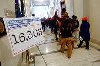 <p>Demonstrators calling for new protections for so-called “Dreamers,” undocumented children brought to the U.S. by their immigrant parents, walk through a senate office building on Capitol Hill in Washington, Jan. 17, 2018. (Photo: Jonathan Ernst/Reuters) </p>