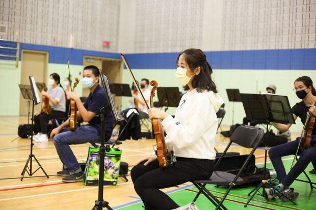 Members of the Mount Royal Youth Orchestra have been split into four groups because they cannot practise together inside under the current health restrictions. (Submitted by Jean MacRae - image credit)