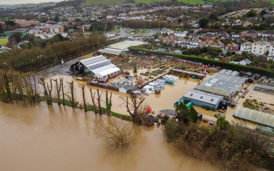 Aerial view of flooding on the River Brit at Bridport in Dorset, which has burst its banks, flooding Groves Nurseries