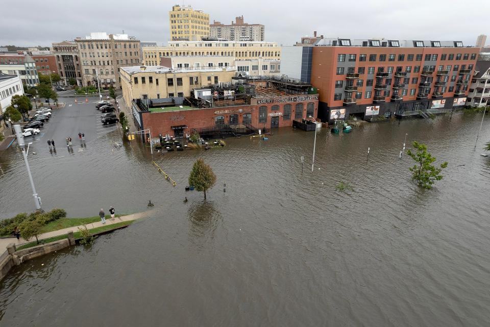 Wesley Lake overflowed its banks Friday afternoon, September 29, 2023, flooding Lake Avenue in Asbury Park, NJ.