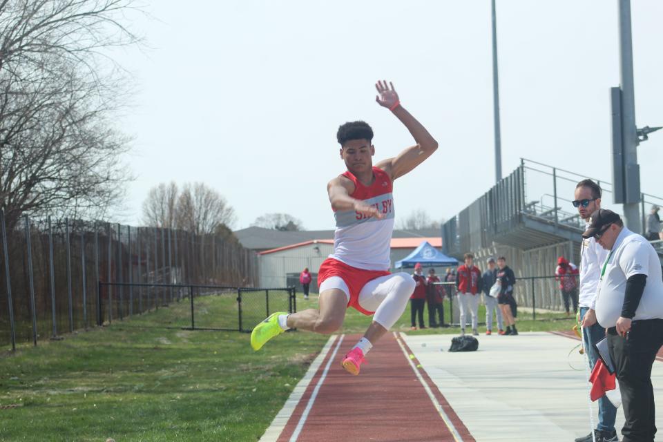 Shelby's Issaiah Ramsey participating in the long jump.