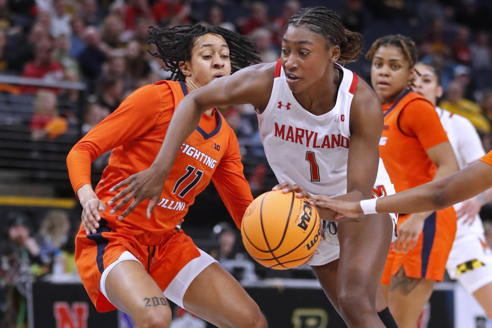 Maryland guard Diamond Miller (1) drives past Illinois guard Jada Peebles (11) during the first half of an NCAA college basketball game at the Big Ten women's tournament Friday, March 3, 2023, in Minneapolis. (AP Photo/Bruce Kluckhohn)\