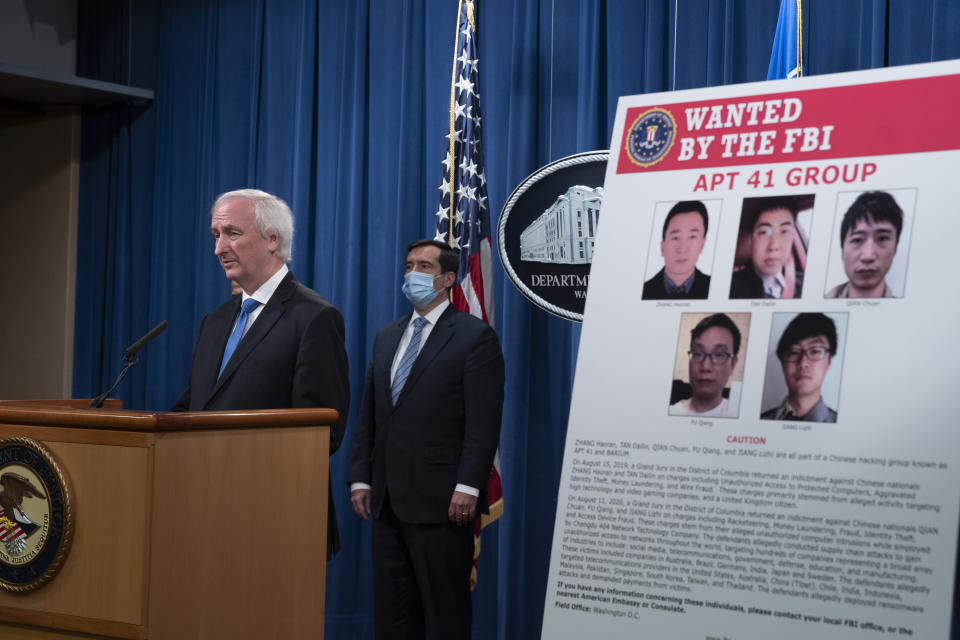 Deputy Attorney General Jeffery Rosen speaks, Wednesday, Sept. 16, 2020 at the Justice Department in Washington. The Justice Department has charged five Chinese citizens with hacks targeting more than 100 companies and institutions in the United States and abroad, including social media and video game companies as well as universities and telecommunications providers. Officials announced the prosecution on Wednesday. (Tasos Katopodis/Pool via AP)