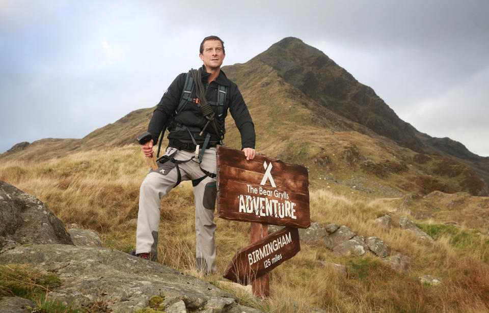  EDITORIAL USE ONLY Bear Grylls on his way up to the top of Cnicht in Snowdonia as Merlin Entertainment announces the launch of 'The Bear Grylls Adventure' - an indoor attraction due to open as a permanent feature at the NEC in 2018. 