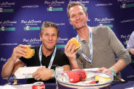 <p>David Burtka and Neil Patrick Harris dig in at the Blue Moon Burger Bash during the Food Network & Cooking Channel's New York City Wine & Food Festival at Pier 86 on Oct. 14.</p>