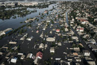 Streets are flooded in Kherson, Ukraine, Wednesday, June 7, 2023 after the walls of the Kakhovka dam collapsed. Residents of southern Ukraine, some who spent the night on rooftops, braced for a second day of swelling floodwaters on Wednesday as authorities warned that a Dnieper River dam breach would continue to unleash pent-up waters from a giant reservoir. (AP Photo/Libkos)