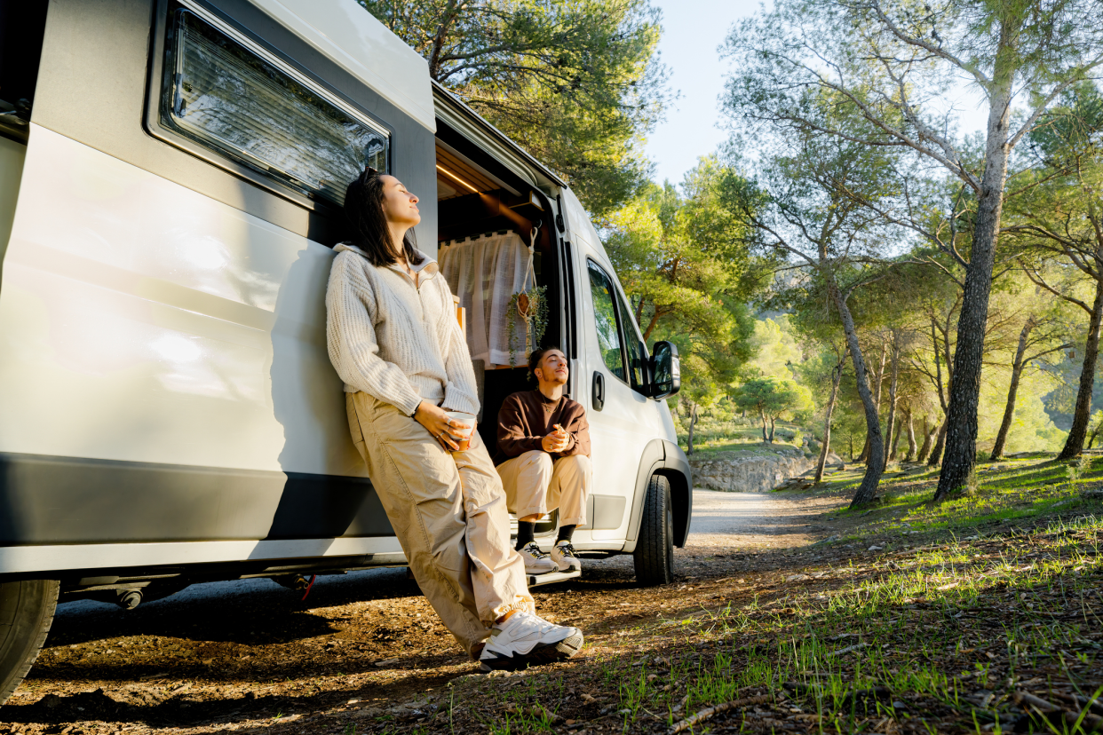 Couple With RV Enjoying the Forest