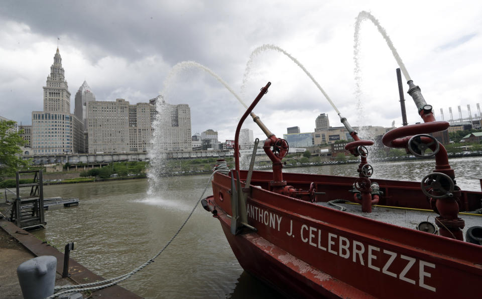 The Anthony J. Celebrezze rests near Fire Station 21 on the Cuyahoga River, Thursday, June 13, 2019, in Cleveland. Fire Station 21 battles the fires on the Cuyahoga River. The Celebrezze extinguished hot spots on a railroad bridge torched by burning fluids and debris on the Cuyahoga in 1969. (AP Photo/Tony Dejak)