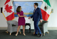 Canadian Minister of Foreign Affairs Chrystia Freeland shakes hands with Mexican Secretary of Economy Ildefonso Guajardo Villarreal before the first round of talks to renegotiate the North American Free Trade Agreement (NAFTA) at the Embassy of Canada in Washington, U.S., August 15, 2017. REUTERS/Joshua Roberts