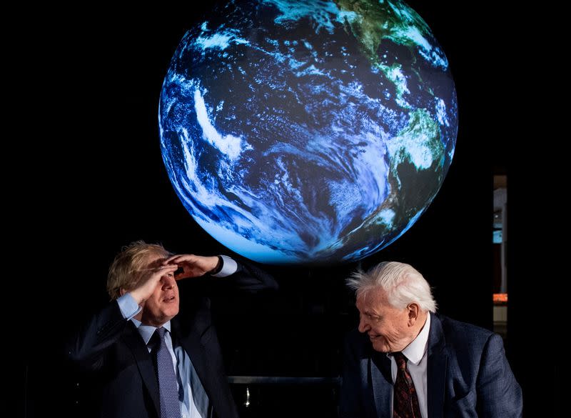 FILE PHOTO: British Prime Minister Boris Johnson and David Attenborough attend a conference about COP26 UN Climate Summit, in London