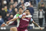 West Ham's Lucas Paqueta, right, and Liverpool's Jarell Quansah battle for the ball during the English Premier League soccer match between West Ham United and Liverpool at London stadium in London, Saturday, April 27, 2024. (AP Photo/Kin Cheung)