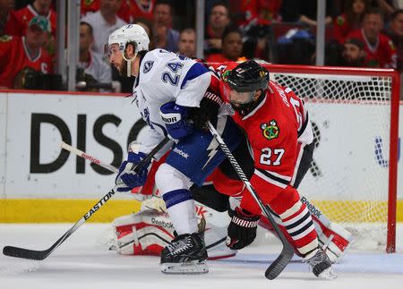 Chicago Blackhawks defenseman Johnny Oduya (27) defends the goal against Tampa Bay Lightning right wing Ryan Callahan (24) during the third period of game six of the 2015 Stanley Cup Final at United Center on Jun 15, 2015. Dennis Wierzbicki-USA TODAY Sports