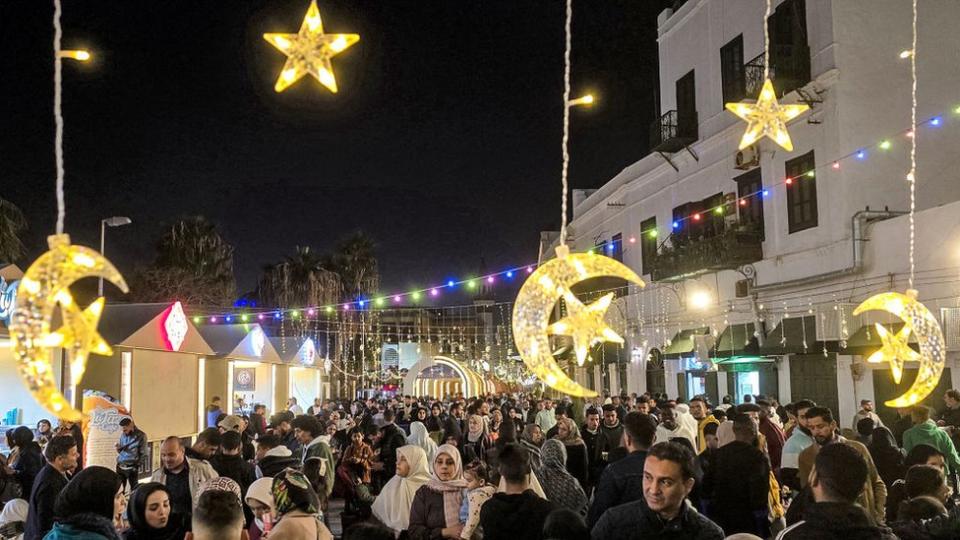 People gather for a night out in the early hours in the old town of Libya's capital Tripoli on March 19, 2024 during the Muslim holy month of Ramadan.