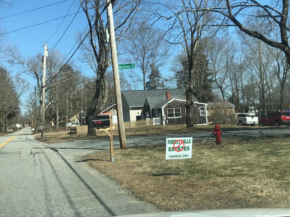 This is one of the signs residents have posted along Forest Street in Dighton opposing the Forest Hills Estates housing development.