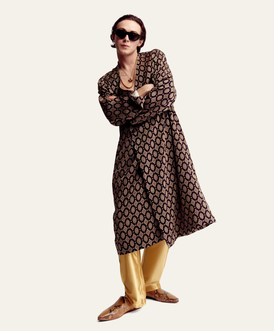 Robe, $1,055, pants, $295, by Needles / Shoes, $1,100, Celine by Hedi Slimane / Sunglasses, $455, by Ahlem