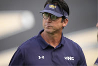 FILE - Northern Colorado head coach Ed McCaffrey looks on as his players warm up before an NCAA college football game against Colorado, Friday, Sept. 3, 2021, in Boulder, Colo. Luke McCaffrey, a wideout from Rice, has strong bloodlines. His dad, Ed McCaffrey, made a Pro Bowl and won three Super Bowls with San Francisco and Denver. Luke McCaffrey is considered a mid-round pick at the NFL Draft. (AP Photo/David Zalubowski, File)