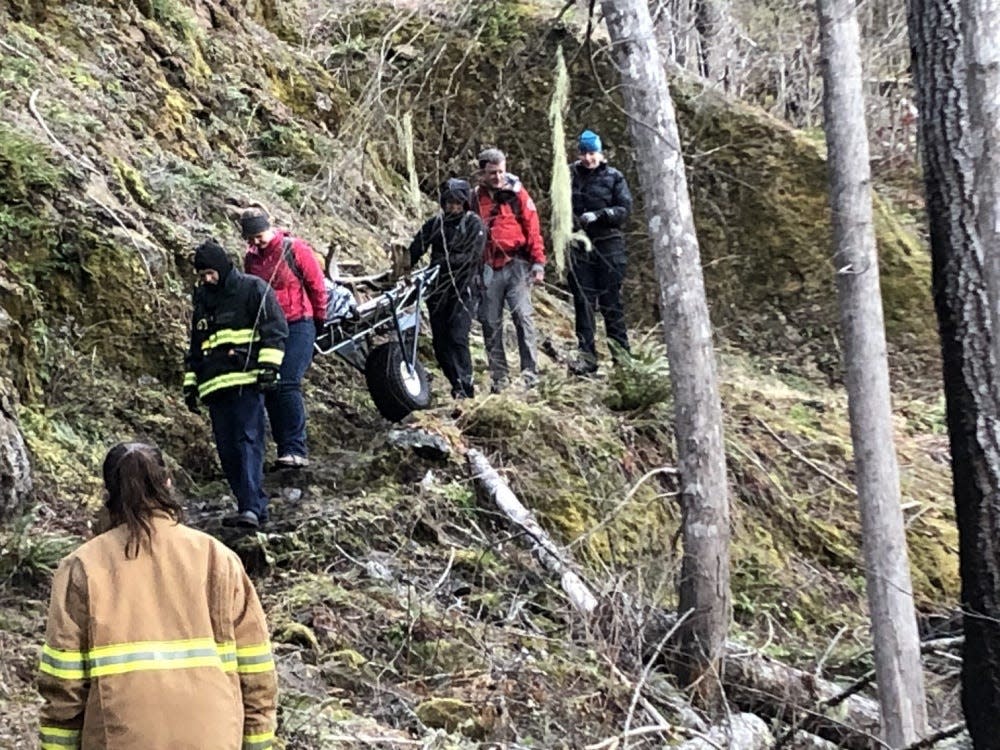 Crews rescue a runner who broke his ankle Friday in a remote area of Olympic National Park. The runner said he had to crawl for hours to get a cellphone signal and call 911.