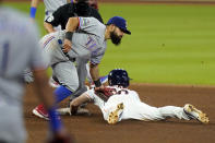 Houston Astros' Kyle Tucker, right, is tagged out by Texas Rangers second baseman Rougned Odor while trying to steal second base during the seventh inning of a baseball game Wednesday, Sept. 16, 2020, in Houston. (AP Photo/David J. Phillip)